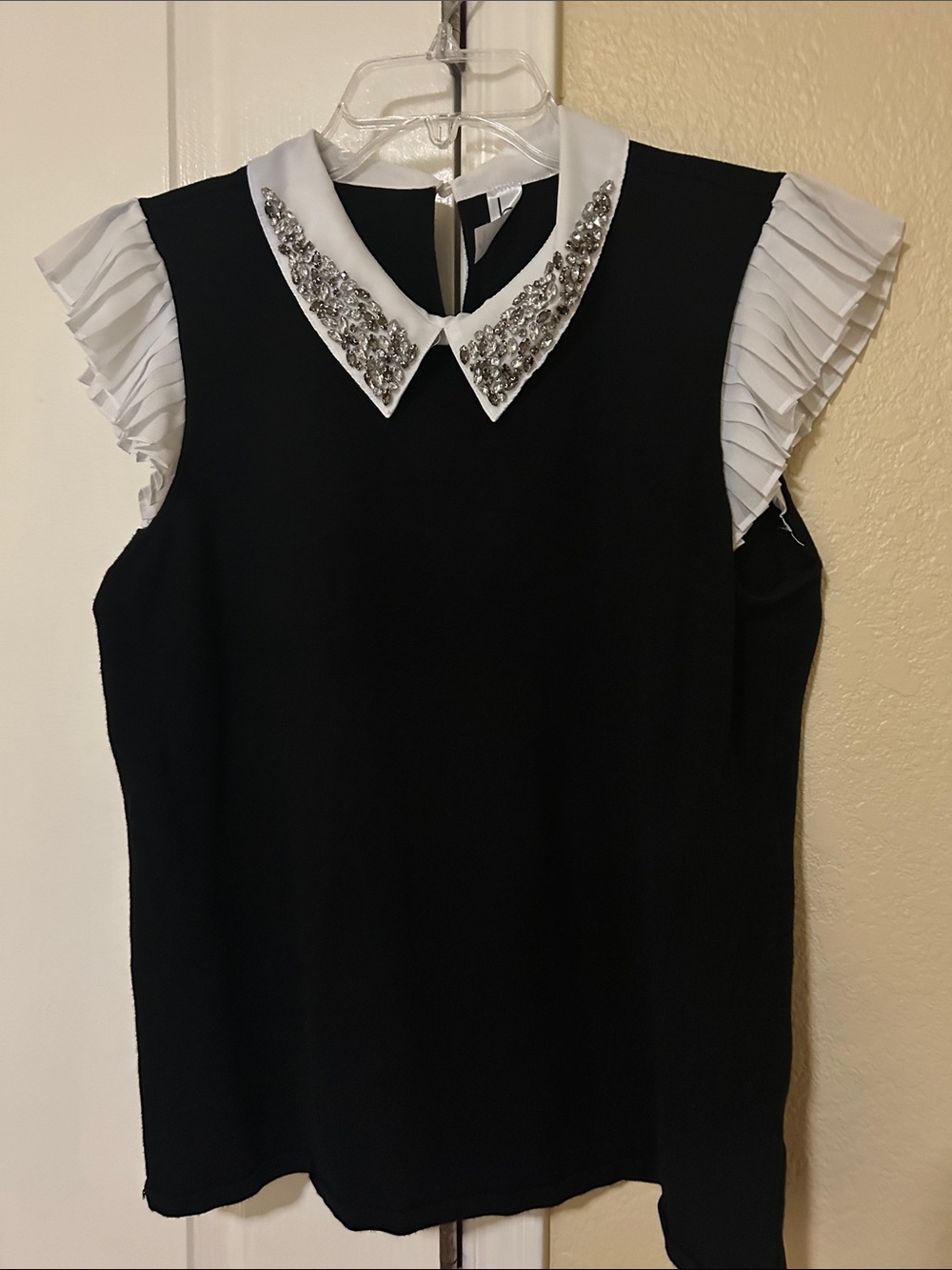 Sleeveless Black Blouse with Embellished White Collar